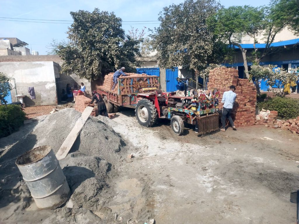 Picture showing the delivery of more bricks